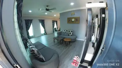 a living room with a couch and a table at Ss homestay in Seri Manjung