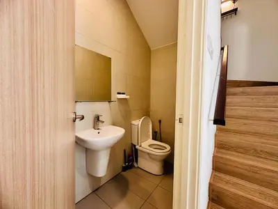 a small bathroom with a toilet and a sink at New Sea Breeze Landed Home 13pax BatuFerrigghi in Batu Ferringhi