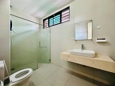 a bathroom with a toilet and a sink and a shower at New Sea Breeze Landed Home 13pax BatuFerrigghi in Batu Ferringhi
