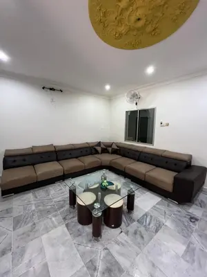 a living room with a couch and a table at KKB Gathering Home - ENTIRE HOME in Kuala Kubu Baharu