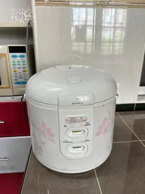 a washing machine sitting on a counter in a kitchen at KKB Gathering Home - ENTIRE HOME in Kuala Kubu Baharu