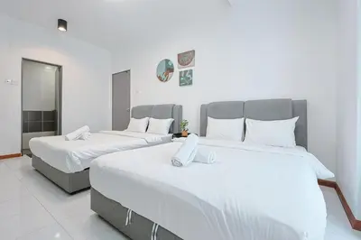 two large beds in a room with white walls at Elegant Studio Escape at Emerald Avenue Brinchang Cameron Highland Clover Home 4-03 in Brinchang