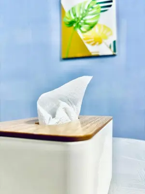 a white paper boat sitting on top of a table at H&Z Guesthouse Kulim Hi-Tech - Free Wifi - Netflix in Kulim