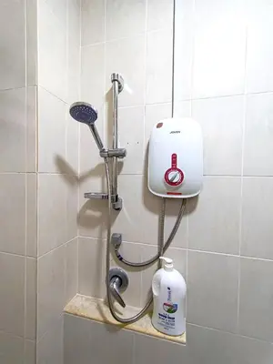 a shower with a blow dryer in a bathroom at H&Z Guesthouse Kulim Hi-Tech - Free Wifi - Netflix in Kulim