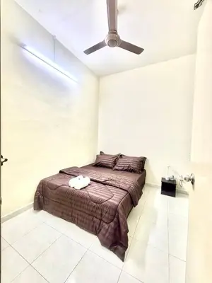 a bedroom with a bed and a ceiling fan at H&Z Guesthouse Kulim Hi-Tech - Free Wifi - Netflix in Kulim