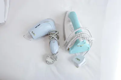 a white and blue phone and other items on a table at Clover Nest Cozy & Stylish Studio Retreat Brinchang - Clover Home 2-03 in Brinchang