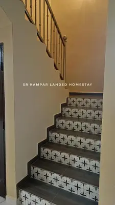 a staircase with star stenciled stairs in a house at SR Kampar 2-Storey LANDED HOMESTAY in Kampar