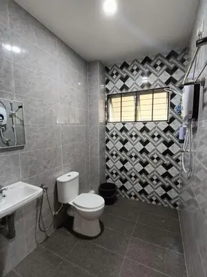 a bathroom with a toilet and a sink at SR Kampar 2-Storey LANDED HOMESTAY in Kampar
