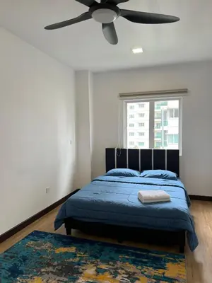 a bedroom with a bed and a ceiling fan at Mkm Villa cameron highland in Tanah Rata