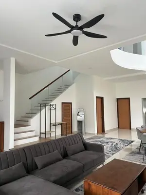 a living room with a couch and a ceiling fan at Mkm Villa cameron highland in Tanah Rata