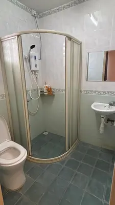 a shower in a bathroom with a toilet and a sink at Comfy21 Homestay Ipoh near Sunway Tambun in Ipoh