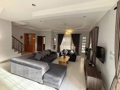 a living room with a couch and a table at Comfy21 Homestay Ipoh near Sunway Tambun in Ipoh