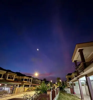 a night time view of a street with houses at Comfy21 Homestay Ipoh in Ipoh