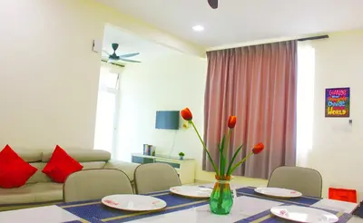 a living room with a table and a couch at Classic Spot - Meru Raya in Ipoh
