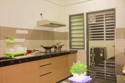 a kitchen with a stove and a counter top at Classic Spot - Meru Raya in Ipoh