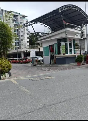 a building with awning on the side of a street at Ummu's homestay in Tanah Rata