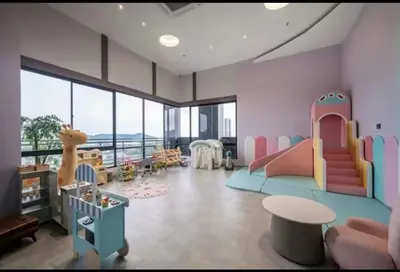 a childrens room with a play area with a slide at Wanderlust Retreat in Bayan Lepas