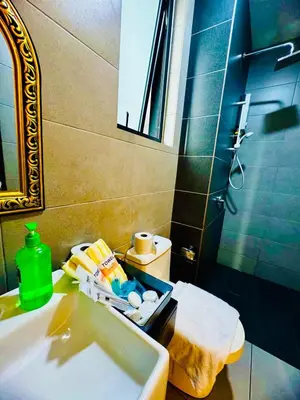 a bathroom with a sink and a toilet at VIP3BR Romantic Retreat for12 withSea & City Views in Jelutong