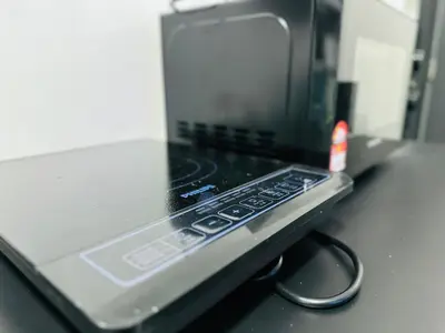 a laptop computer sitting on top of a counter at Deluxe Suites with Infinity Pool, Kids' Pool & Sea in Jelutong