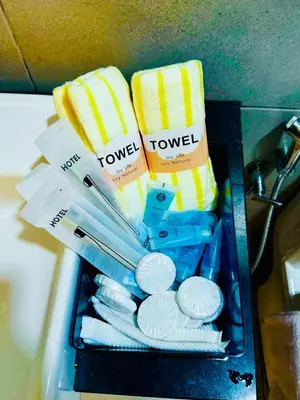 a box filled with toothbrushes and towels at Deluxe Suite for10 Stunning Sea &City ViewsNetflix in Jelutong