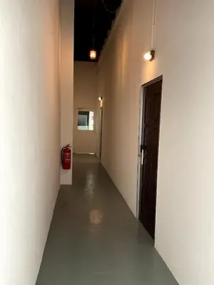 a hallway of an empty room with a door at 39 Love Lane - Smart Intelligent Inn Georgetown in George Town