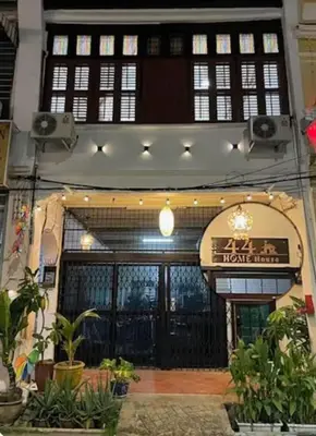a building with a sign on the front of it at HOME House in George Town
