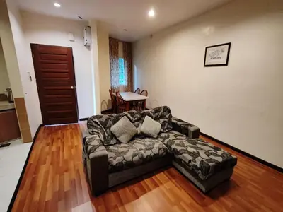 a living room with a couch and a table at Iris House Resort & Apartment Cameron Highlands in Cameron Highlands