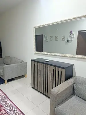 a living room with a couch and a mirror at Ed 01 sitiawan homestay in Sitiawan