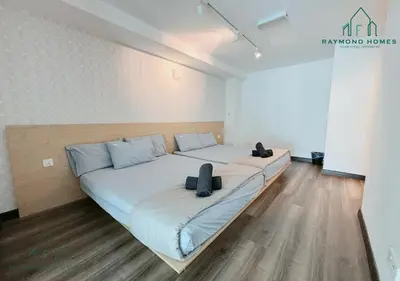 a large bed in a room with two shoes on it at Maritime Sea View Duplex in George Town