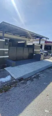 a building with a roof and a sidewalk at Chill Spot Homestay in Ipoh