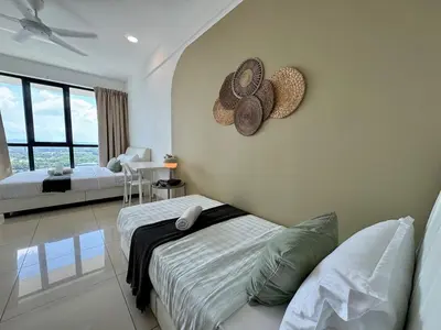 a bedroom with two beds and two hats on the wall at NEW-Serene Home Juru Sentral Icon City in Bukit Mertajam