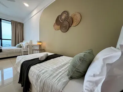 a bedroom with a bed and two hats on the wall at NEW-Serene Home Juru Sentral Icon City in Bukit Mertajam