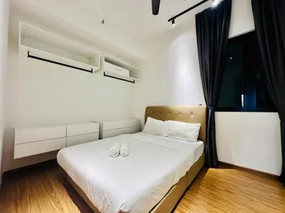 a bedroom with a bed with two shoes on it at Elegant 2BR Luxury Suite in Haaven in George Town