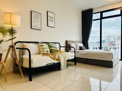 a bedroom with two beds and a couch and a window at Fresh, Modern Georgetown Suite with Sky Pool Views in George Town