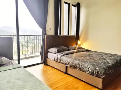 a bedroom with a bed and a large window at Luxury Sky Pool 8-Pax City Centre Beacon in George Town