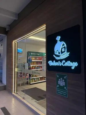 a store with a sign on the side of a building at Muhammad Najmi Hakim Bin Abdullah in Kampar