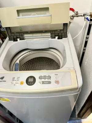 a close up of a washing machine in a room at Bahari 58 in George Town