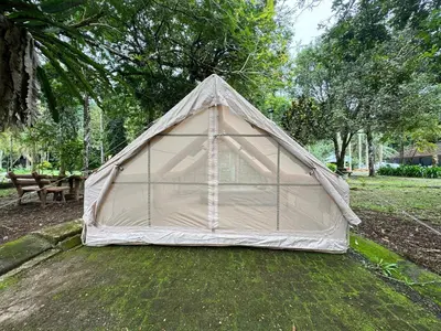 a tent sitting on the grass in a park at Glamping in Tapah