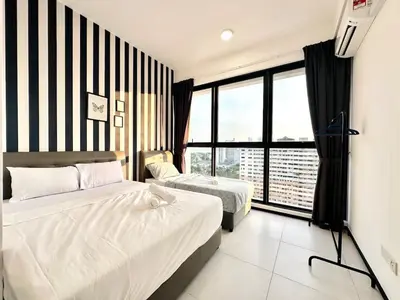 a bedroom with two beds and a large window at Classic House in Georgetown 3BR 10pax in George Town