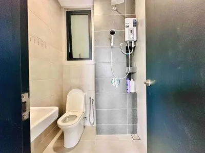a bathroom with a toilet and a shower in it at newly renovation apartment 3BR pool 10 pax in George Town