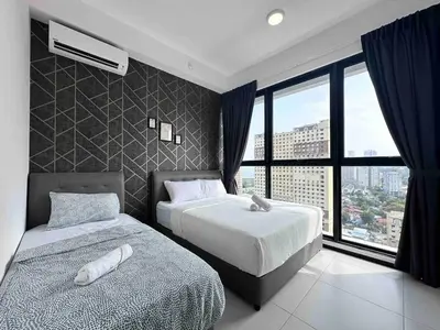 a bedroom with two beds and a large window at newly renovation apartment 3BR pool 10 pax in George Town