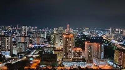 a city skyline at night with lit buildings at Sea View Condo In Georgetown 10 pax in George Town