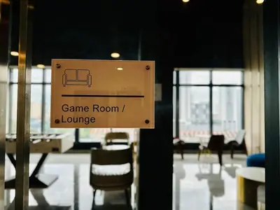 a sign that says game room and lounge at Sea View Condo In Georgetown 10 pax in George Town