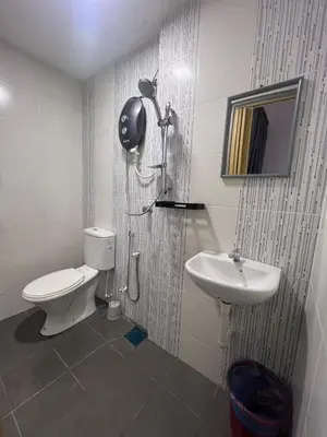 a bathroom with a toilet and a sink at RedHouse Sky Garden Klabang 10 pax in Chemor