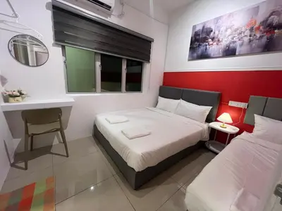a small bedroom with a bed and a desk at RedHouse Sky Garden Klabang 10 pax in Chemor