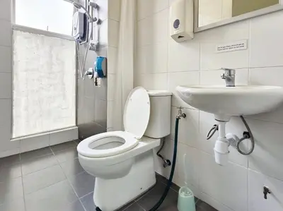 a bathroom with a toilet and a sink at TheFloral Penthouse Night Market Wifi & Netflix in Brinchang