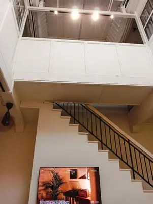 a staircase in a building with a stair case at Senju Georgetown Heritage PrewarHouse 4BR 5-15 pax in George Town