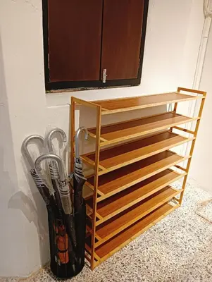 a wooden rack with utensils in a room at Senju Georgetown Heritage PrewarHouse 4BR 5-15 pax in George Town