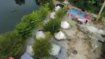 an overhead view of a group of tents and trees at Tok Mat Village & Adventure Park in Kampong Kepayang