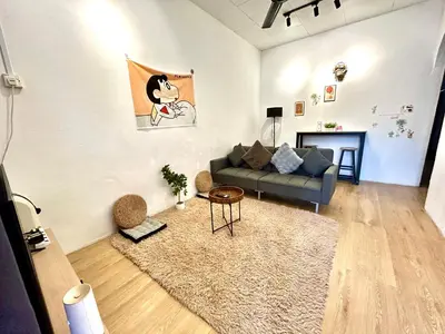 a living room with a couch and a rug at Cozy95#6pax#Netflix#SukunBukitMertajam in Bukit Mertajam